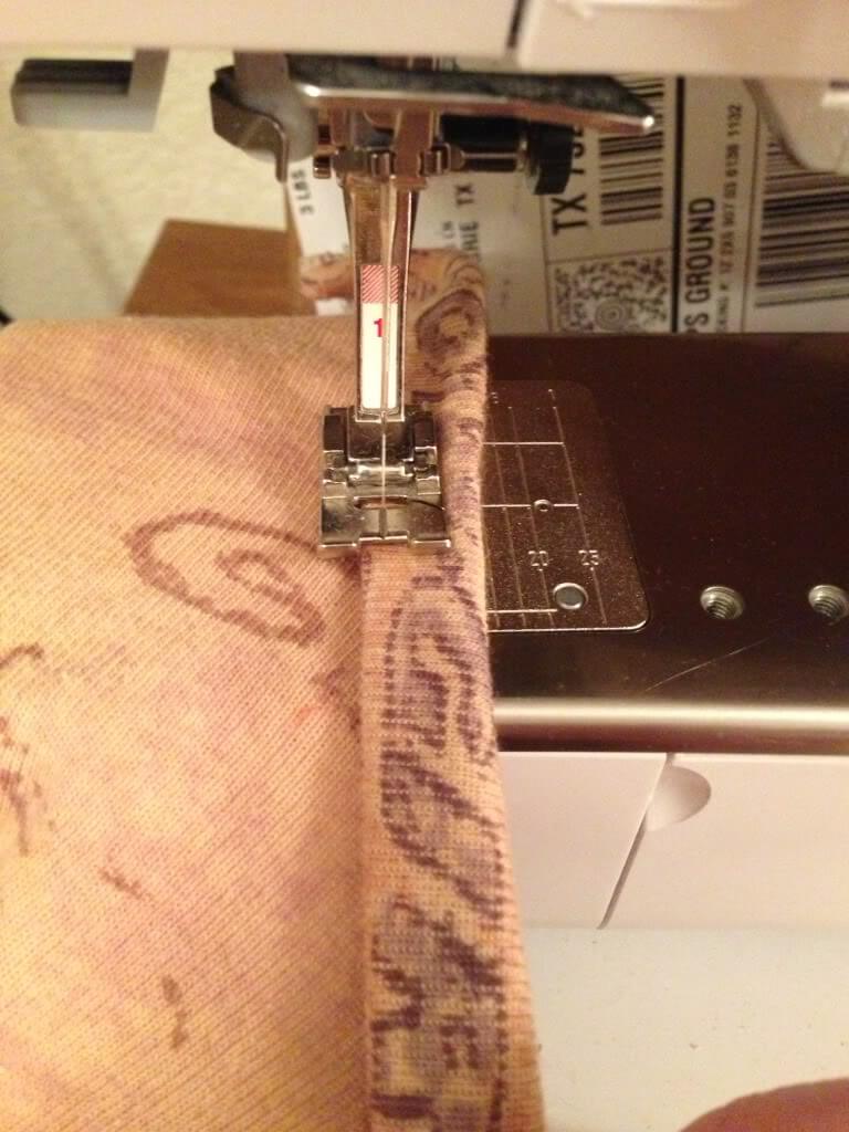 Topstitch the armhole binding at the lower edge. 