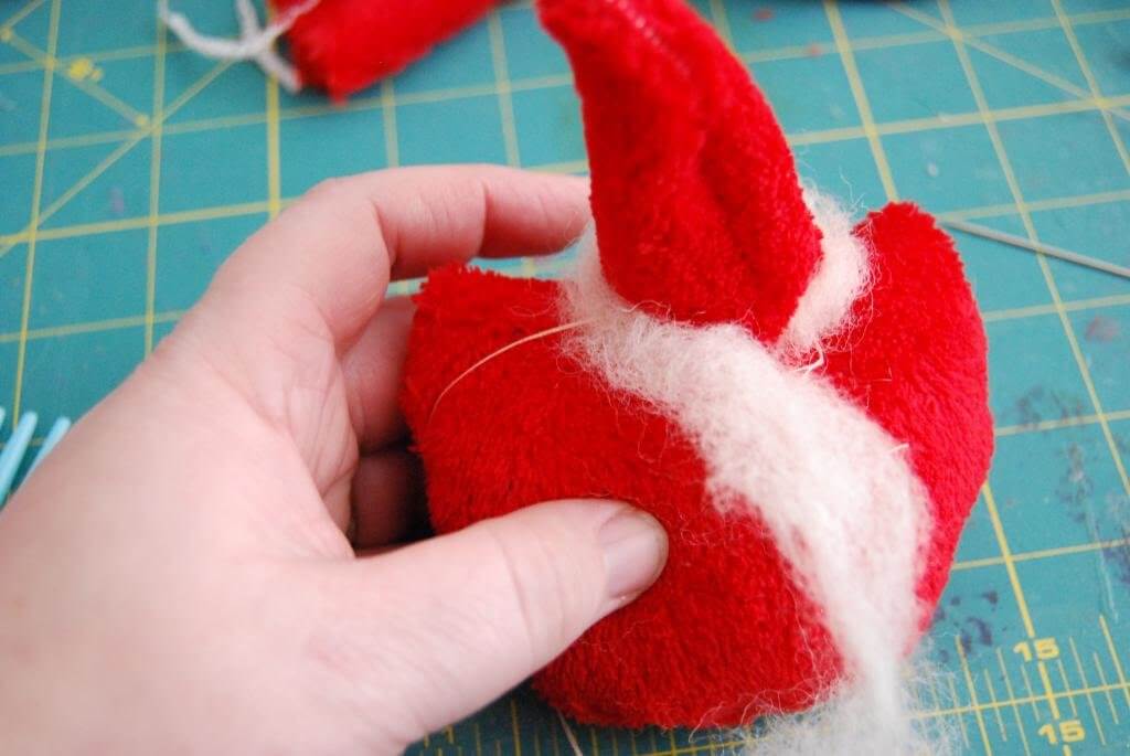 Give your Tiny Santa a wool-trimmed hat / hair. 