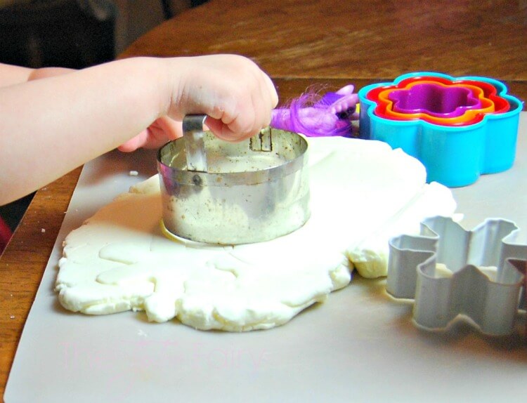 Cutting shapes out of Cool Whip Play Dough
