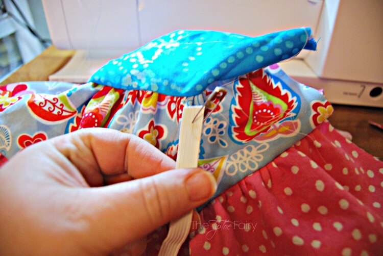 Use a safety pin to thread the doll twirly skirt