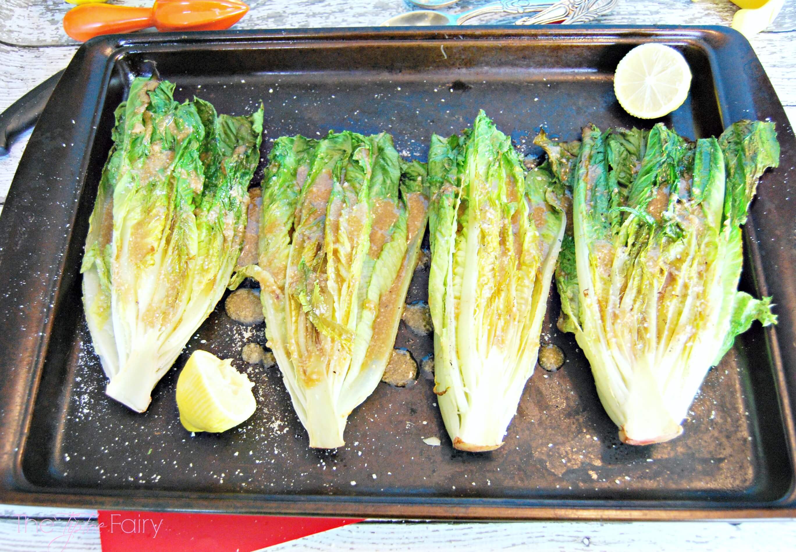 Grilled Romaine lettuce with Caesar vinaigrette dressing. 