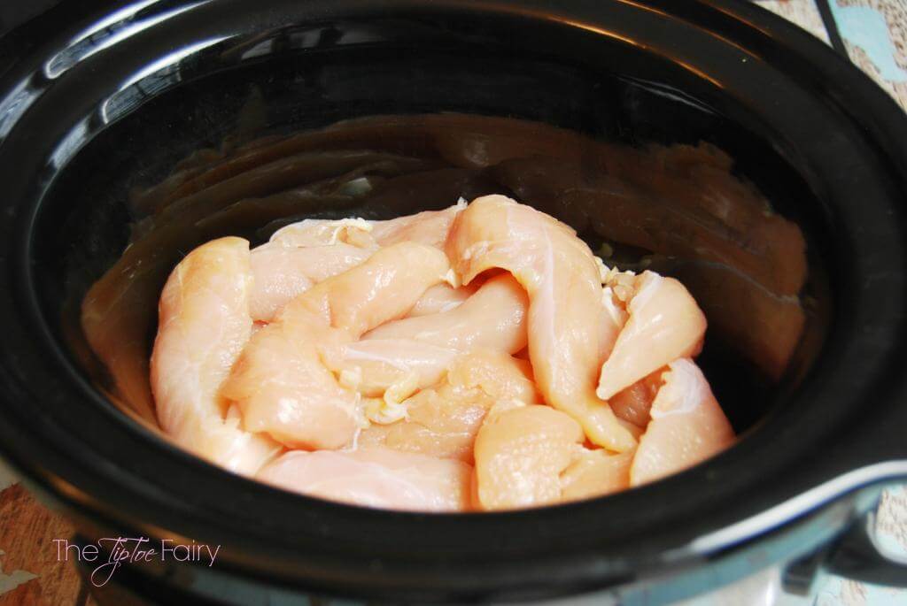 Add 5-6 chicken breasts or 1 1/2 lbs of chicken tenderloins to the slow cooker. 