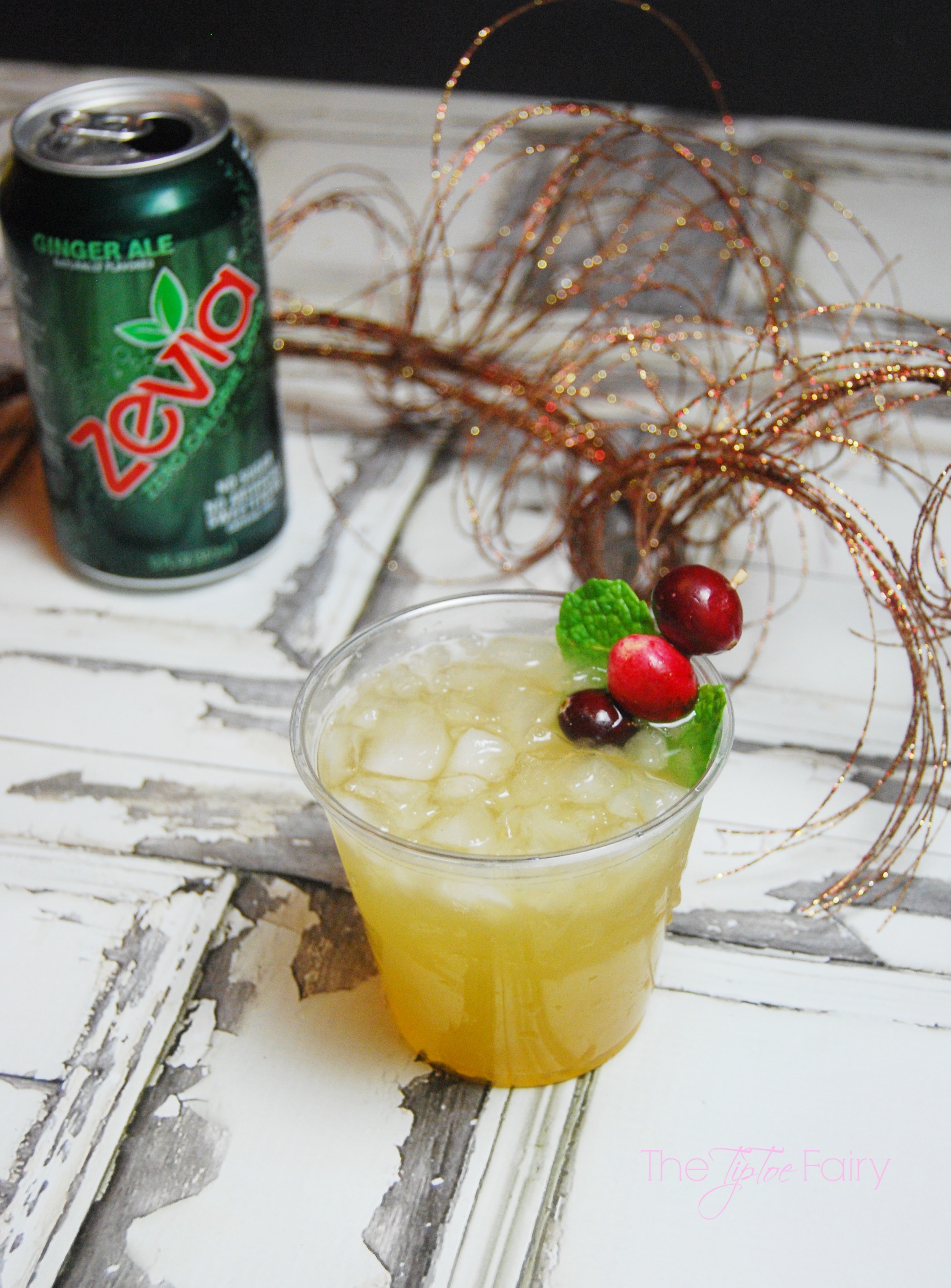 the tipsy reindeer drink with a green can of Zevia ginger ale with a sprig of gold in the background