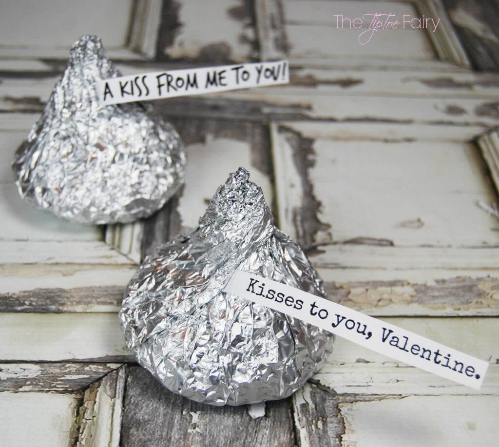 Rice Krispie Kisses wrapped in foil with paper tags