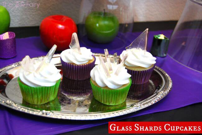 Several cupcakes with sugar glass shards. 