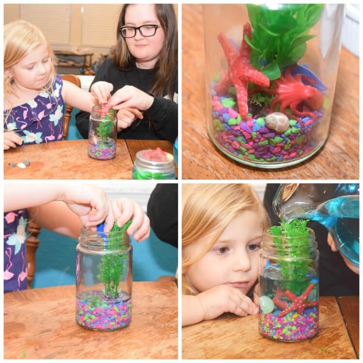 A collage of four images showing a big sister and little sister adding the sea creatures and blue water to the Light Up Mason Jar Aquarium