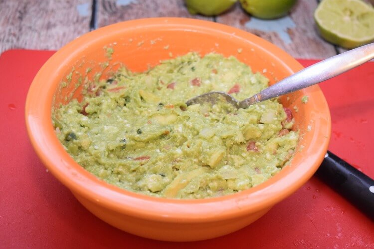 Easy fresh Guacamole chocked full of #LaVaquitaCheese and veggies! #ad #food