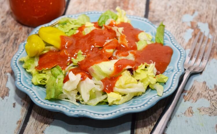 A salad topped with Red Italian Salad Dressing