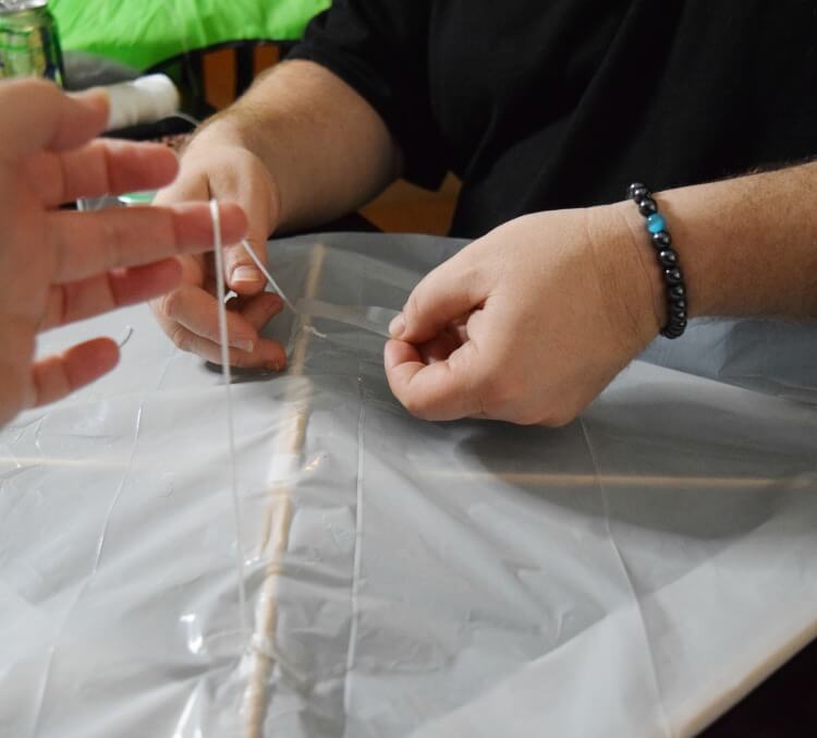 tie off your DIY Trash Bag Kite!