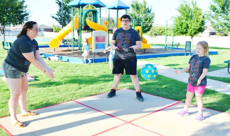 Playing Four Square at the park with the kids