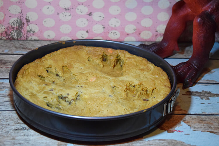 Push the Dinosaur Feet into the freshly baked cookie pizza