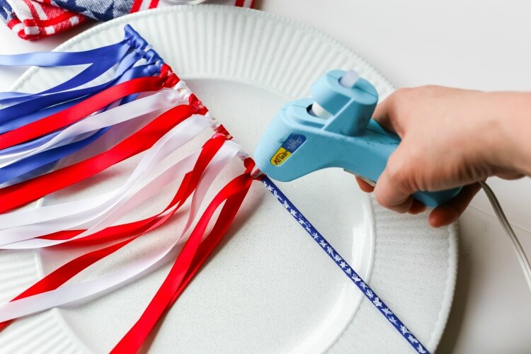 Add a dollop of glue to the ribbon so it won't come off. 