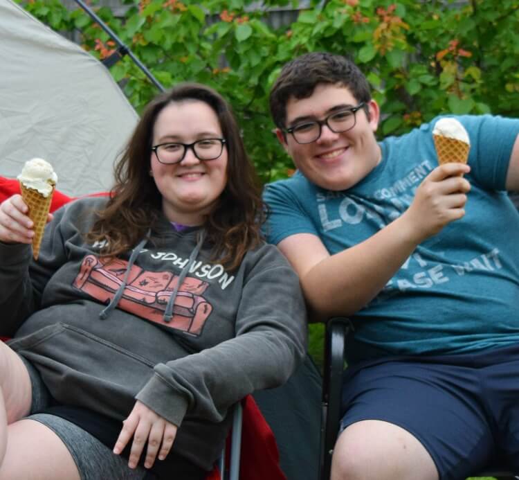 Brother and sister with ice cream cones. 