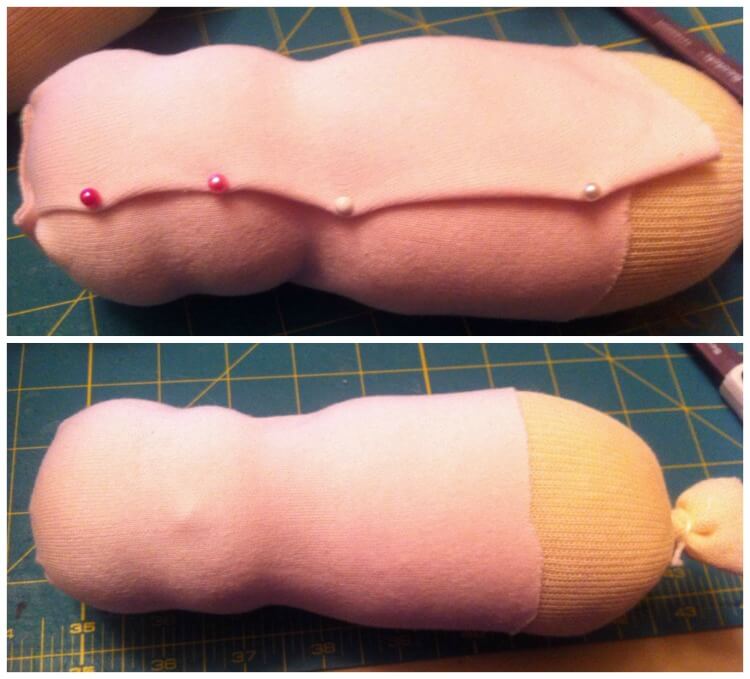 Pinning and smoothing the doll skin onto the body. 