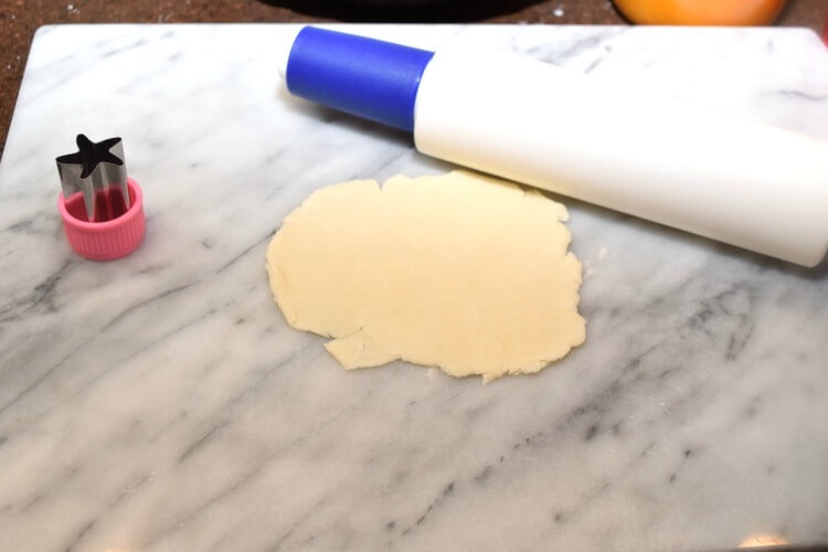 Rolling pie crust out on my marble pastry board.