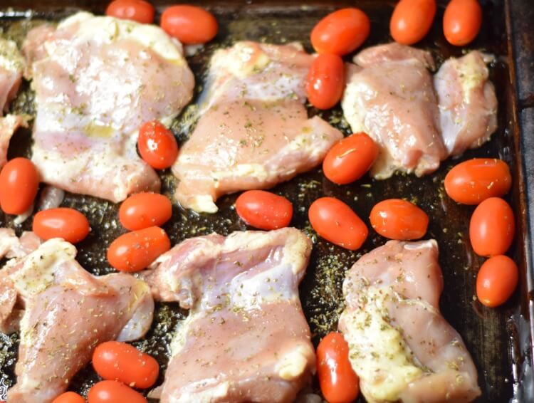 Chicken Thighs and grape tomatoes with seasoning