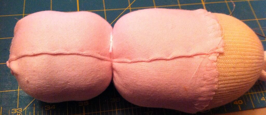 How to sew the doll skin onto the head and body of a Swaddle Baby Doll.