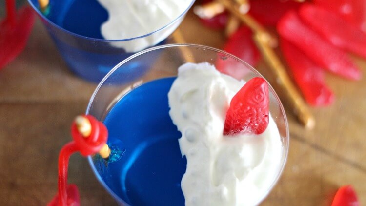 Close up of whipped cream and Swedish Fish on the JELLO fishing cup
