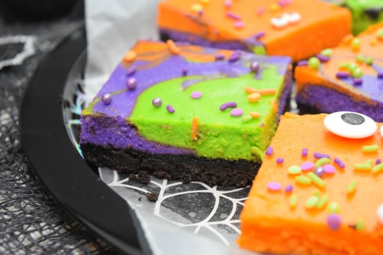 Super close up of the layers of Monster Mash Halloween Cheesecake Bars