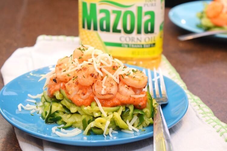 Shrimp and Zucchini Noodles topped with creamy tomato sauce.