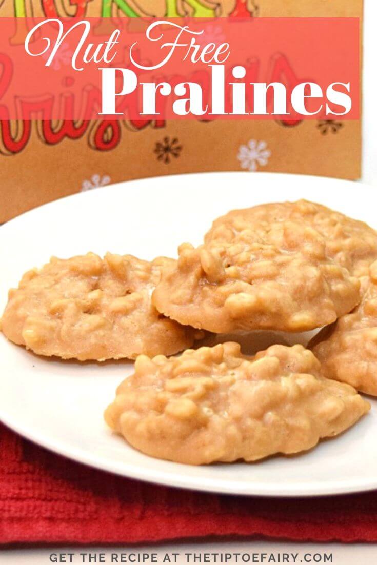 A plate full of nut free pralines in front of a Merry Christmas box.