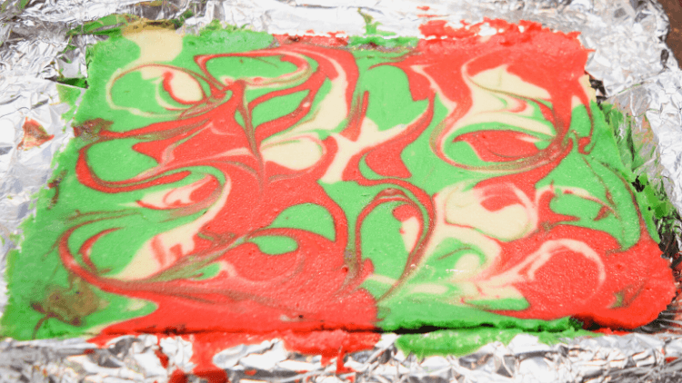Christmas Swirl Cheesecake Bars are baked and ready to come out of the pan. 
