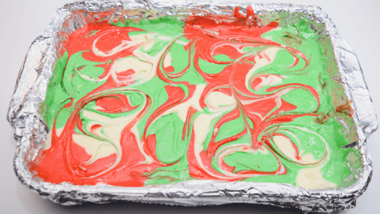 Swirling the cheesecake batter for Christmas cheesecake bars. 