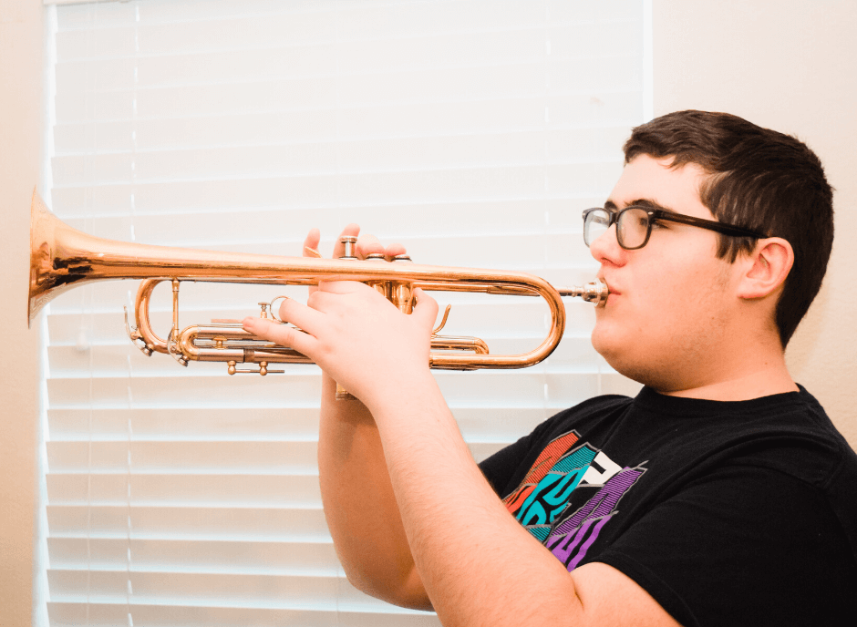 Teenage boy playing the trumpet
