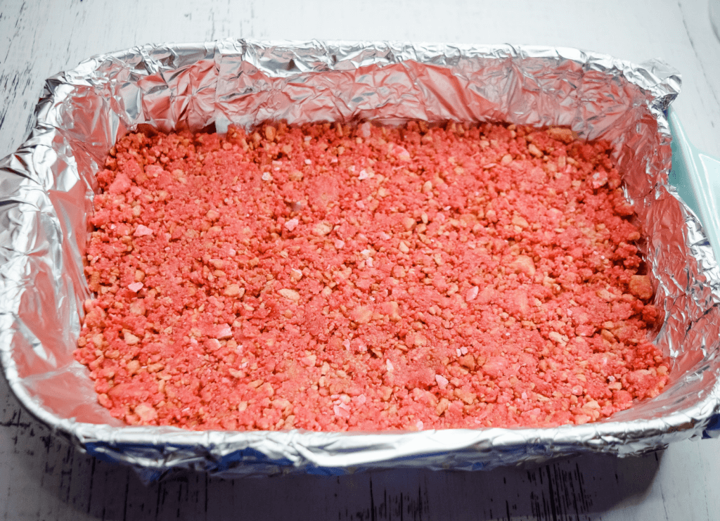 Foiled 9 x 13 pan with a pink cookie crust. 