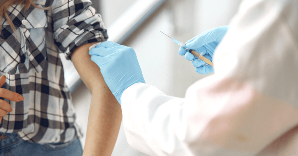 A young person getting a vaccination.