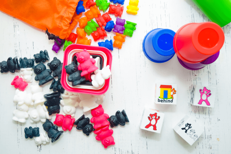 Sets of rainbow bears and pink, black, and white bears. 