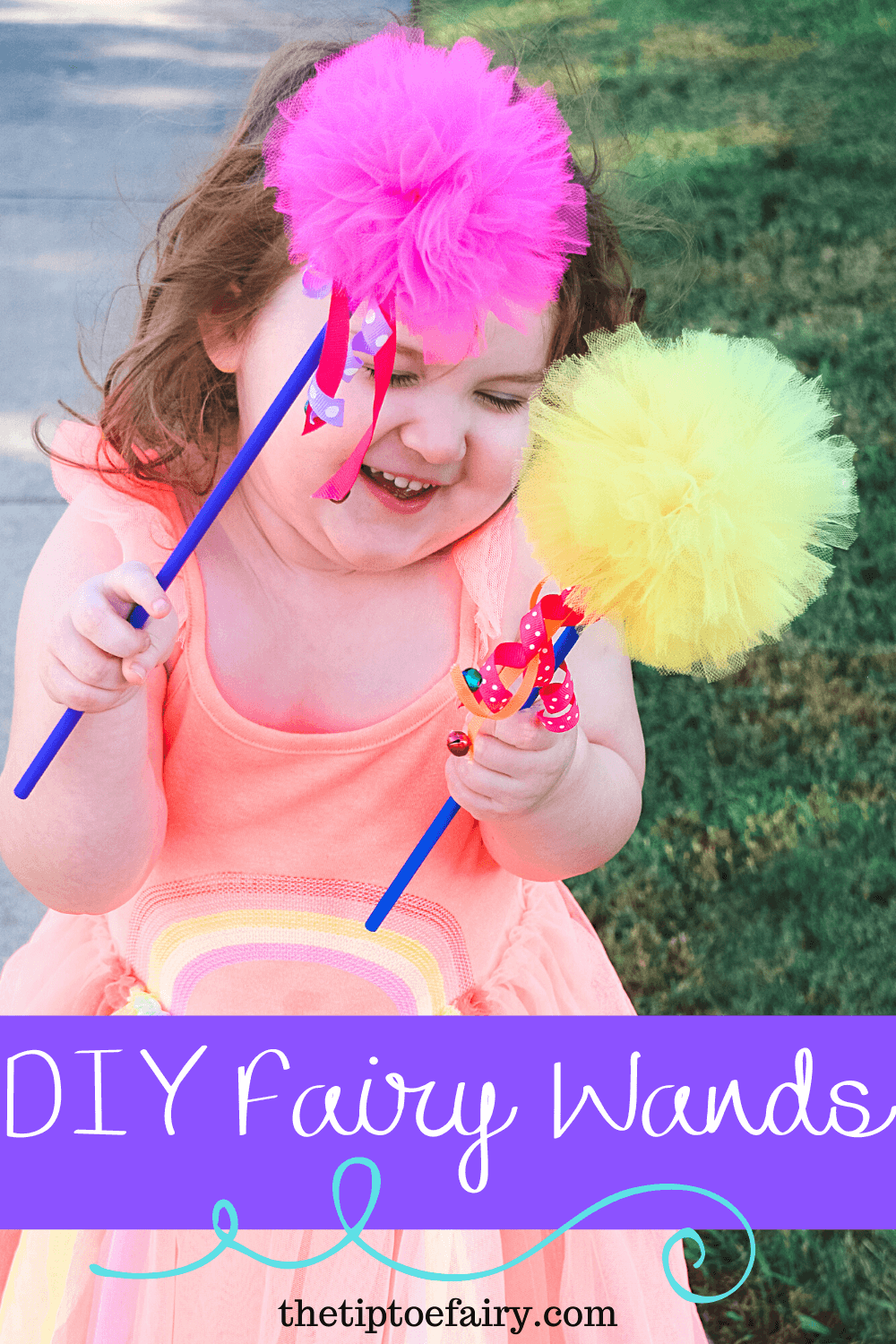 A little girl with fairy wands in a peach dress. 
