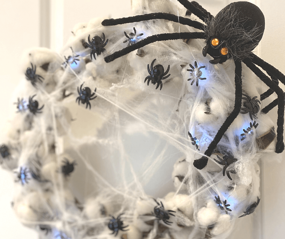 Adding the big spider to the top of the cotton spider web wreath