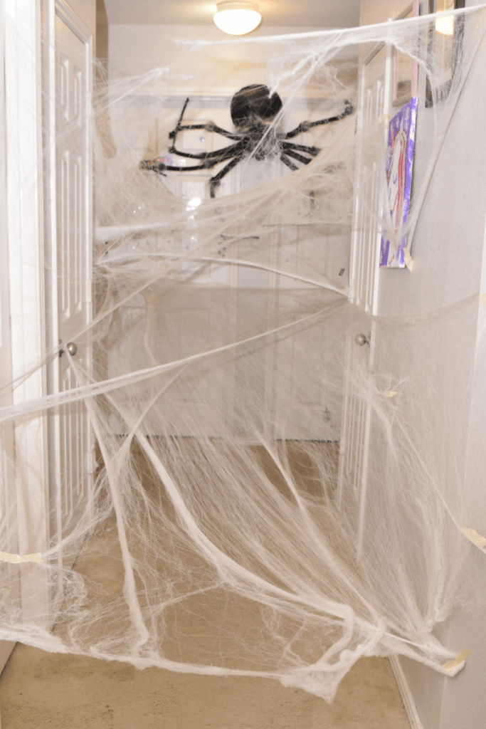 The hallway full of spider webs they must crawl through. 