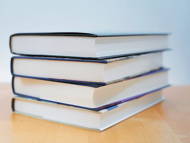 A stack of hardback novels. 