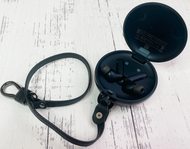 The PaMu Quiet ANC wireless earbuds in the case with the leather lanyard. 