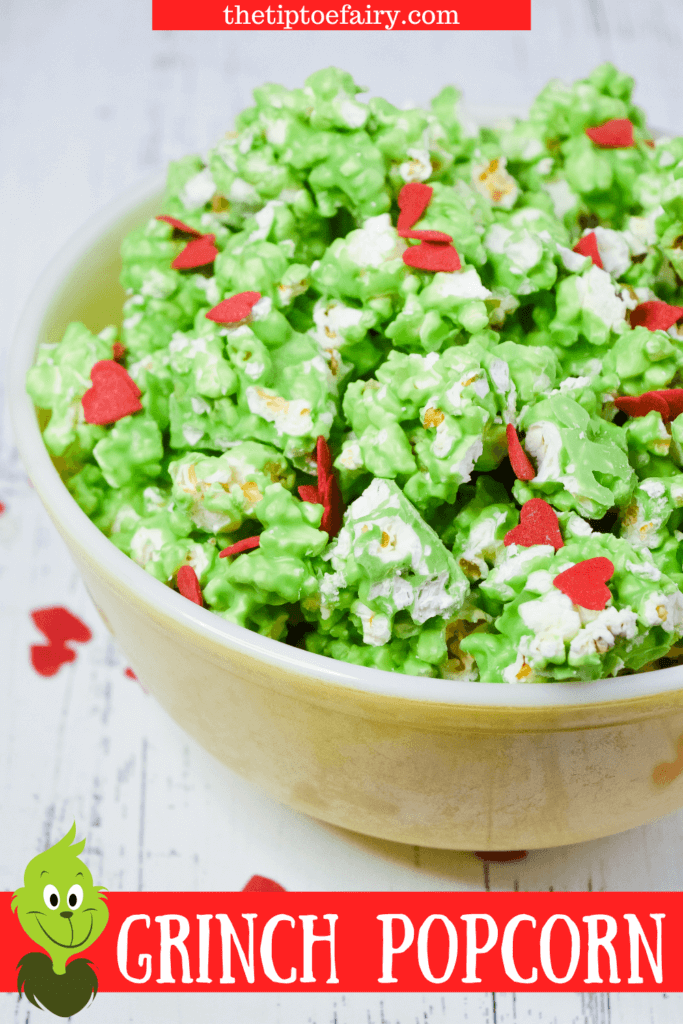 A close up of the green grinch popcorn with red candy heart sprinkles.