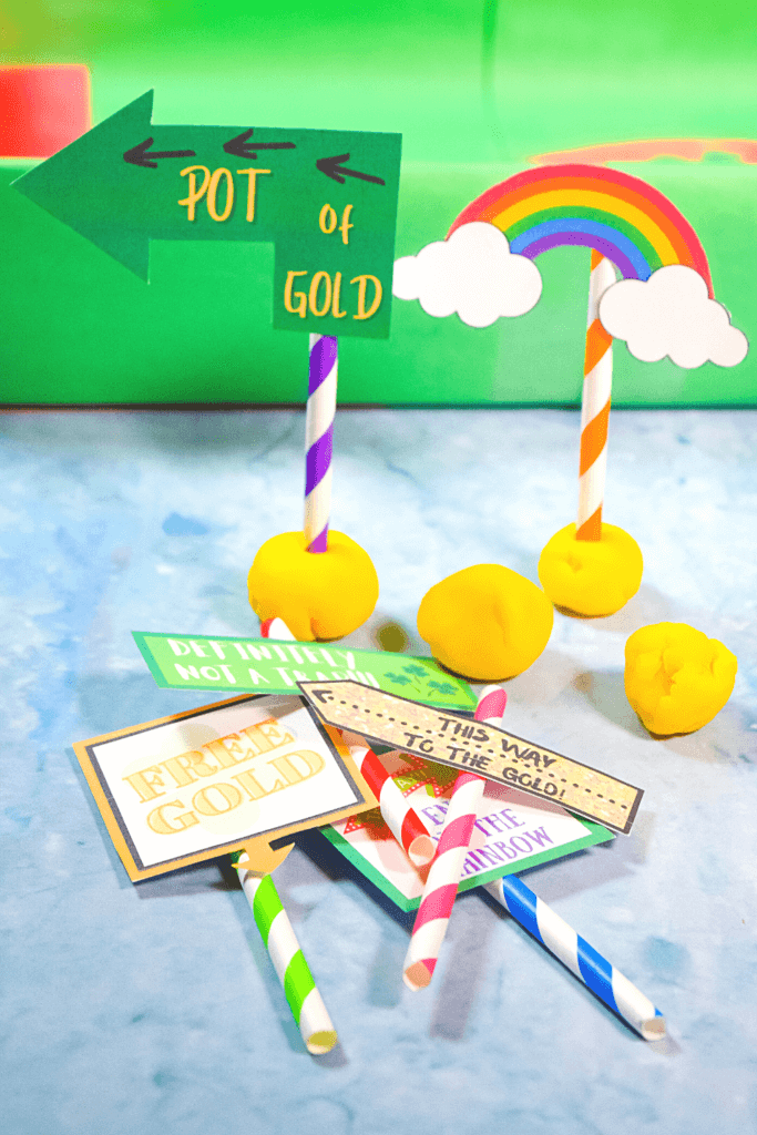 The leprechaun signs printed out and placed on colorful straws and put in yellow playdoh to stand up.