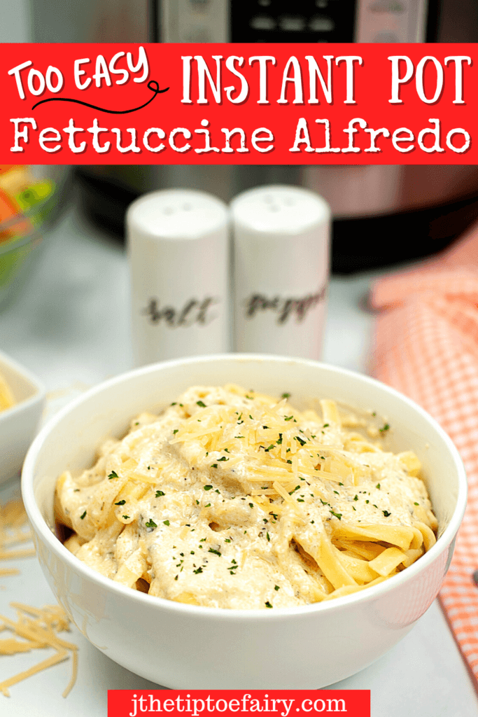 A big bowl of fettuccine alfredo with parsley with a salt and pepper shaker behind it as well as an instant pot