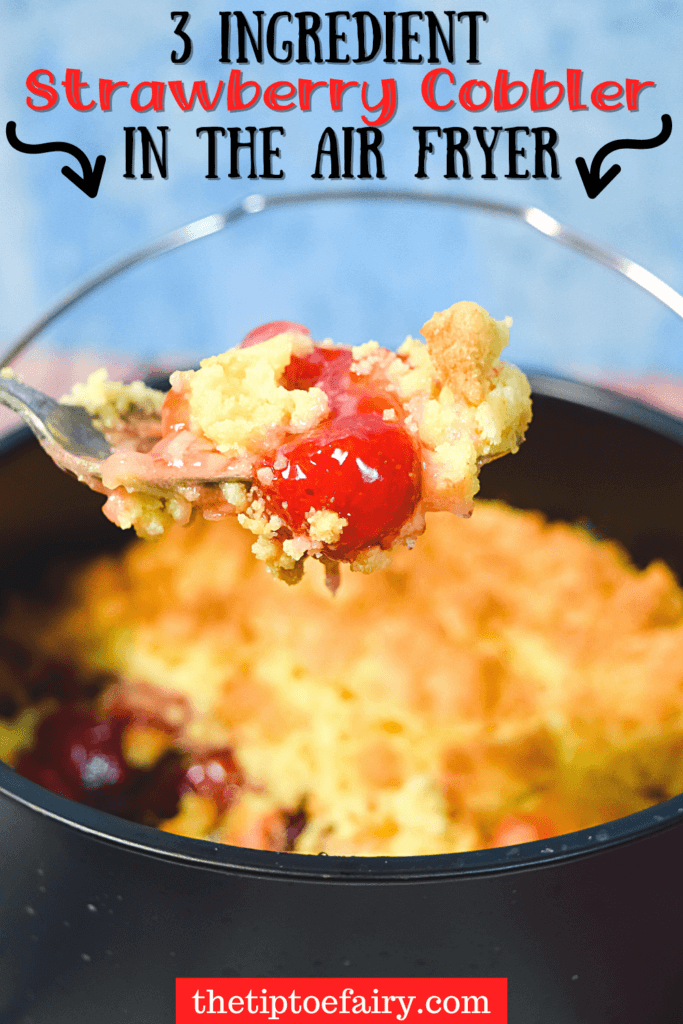 Title image of 3-Ingredient Strawberry Cobbler in the Air Fryer with a spoonful of cobbler held up above the cake barrel full of strawberry cobbler. 