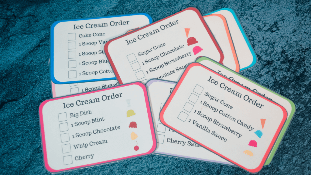Ice Cream Orders printed out and laminated on a blue background