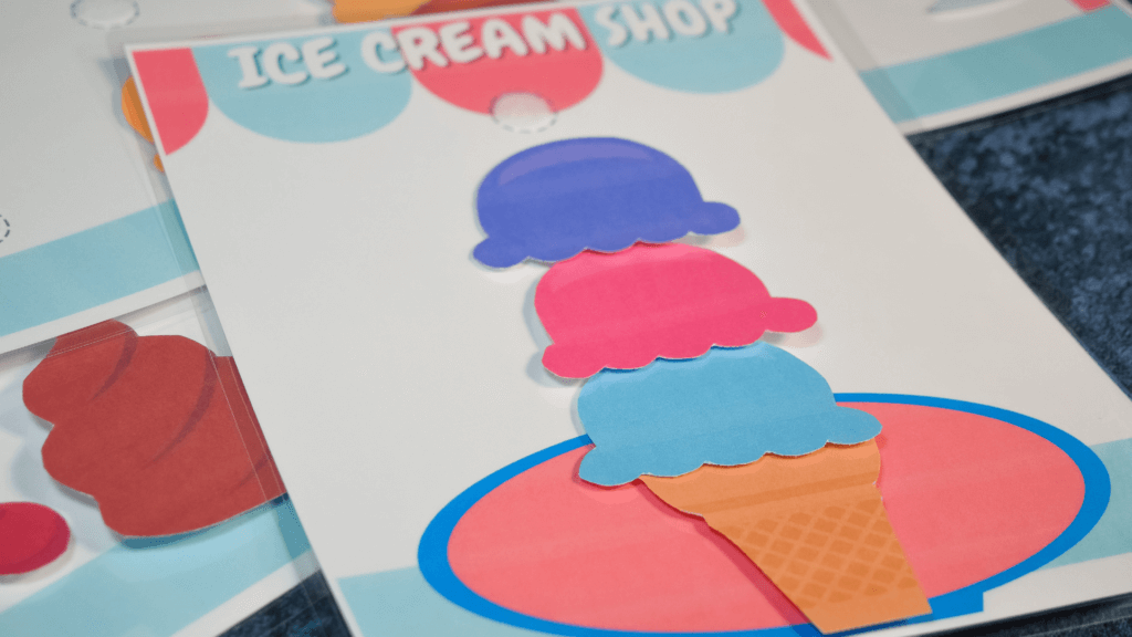 A finished ice cream order printable game with ice cream cone, blue ice cream, pink ice cream, and purple ice cream. 