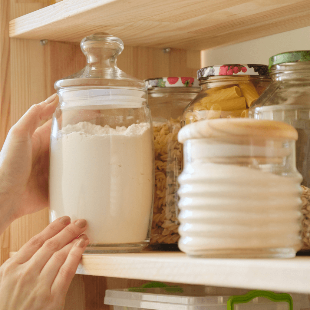 Easy Homemade Buttermilk Pancake Mix in a jar on a shelf with other jars of pasta