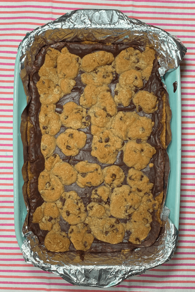 Overhead image of a pan of fudge stuffed cookie bars before they're cut into squares