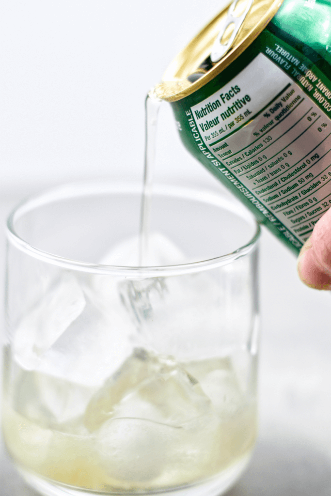 Pouring the Ginger Ale into the glass. 