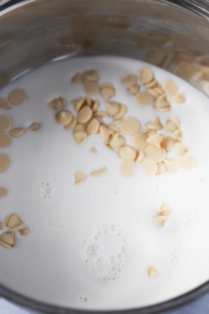 Close up image of milk and white chocolate chips in a pan.