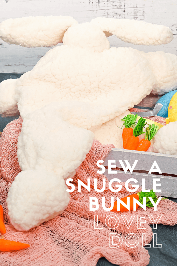 Title image for Sew a Snuggle Bunny Lovey Doll with the finished doll in a crate with carrots. 
