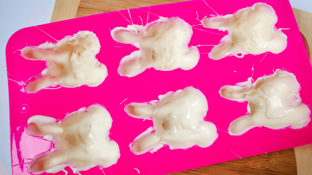 Layering the white chocolate for the Easter Bunny Hot Cocoa Bombs