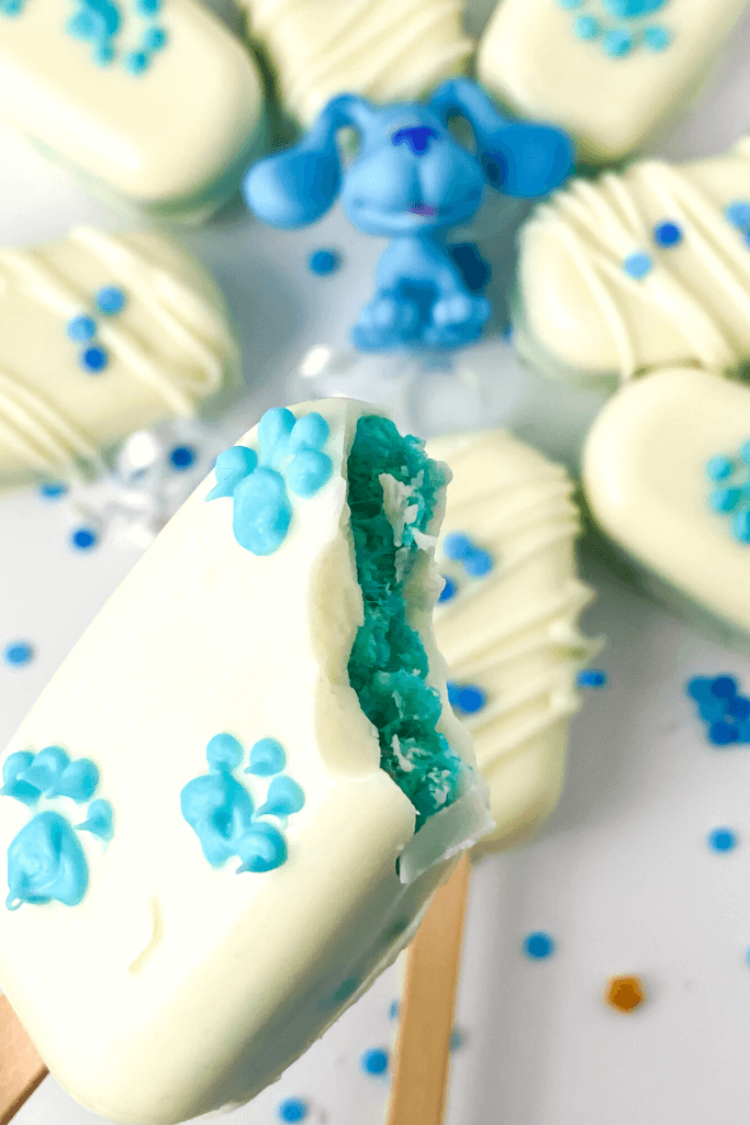 A close up of a Blue's Clues Rice Krispies Treat Pop with a bite taken out