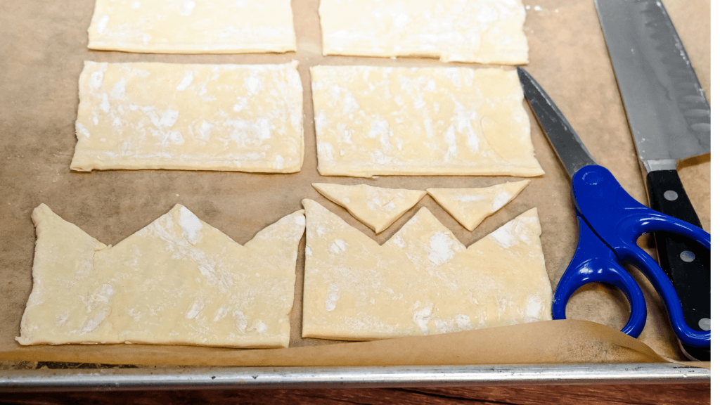 Scissors to cut triangles in the top of each rectangle of puff pastry to look like a crown. 